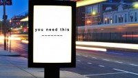 Blank Billboard on City Street at Night