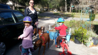 Asher, Leah and Aryeh play on the street where they live.