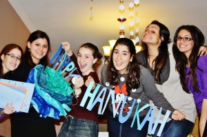 Queens College students celebrating Chanukah. (Shoshana Charnoff)