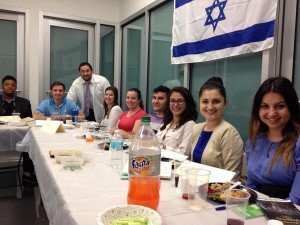 Southern NCSY's Rabbi Ben Gonsher (in the kittel) led a seder for students at St. Thomas University School of Law.