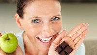 Woman Choosing Between Food