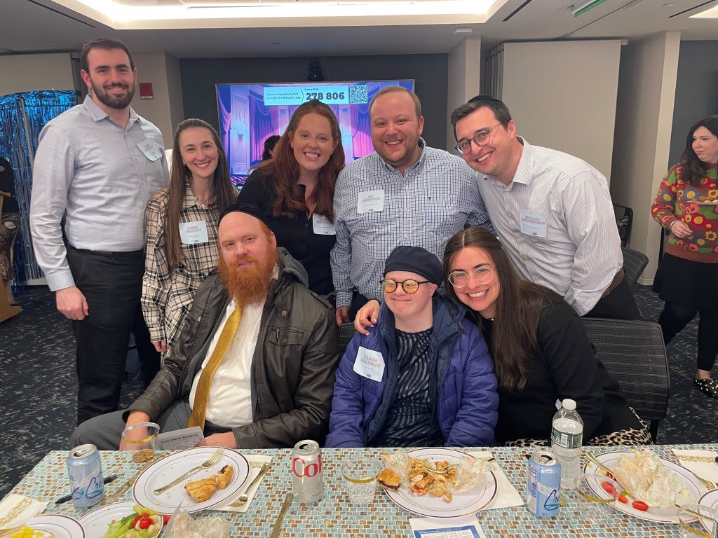 L to R (back row) at the Met at Yachad dinner: Josh and Sammi Aranoff; Rena and Avi Kirshtein; and Betzalel Rosenwasser. Front row: Chaim and Tamar Goldman and Lani Rosenwasser.