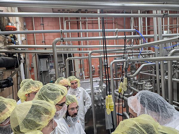 ASK OU Summer Kashrus Training Program participants visiting a dairy facility.
