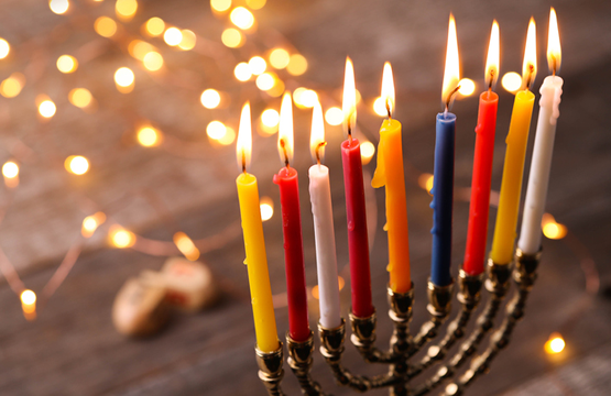 I did not return home until after midnight. In my neighborhood, at that hour of the night, the streets are deserted. May I still light Chanukah candles with a bracha?