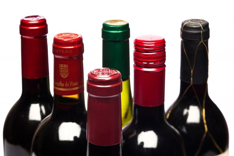 Selection of red wine bottles focus on neck