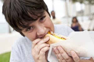 Boy Eating Hotdog